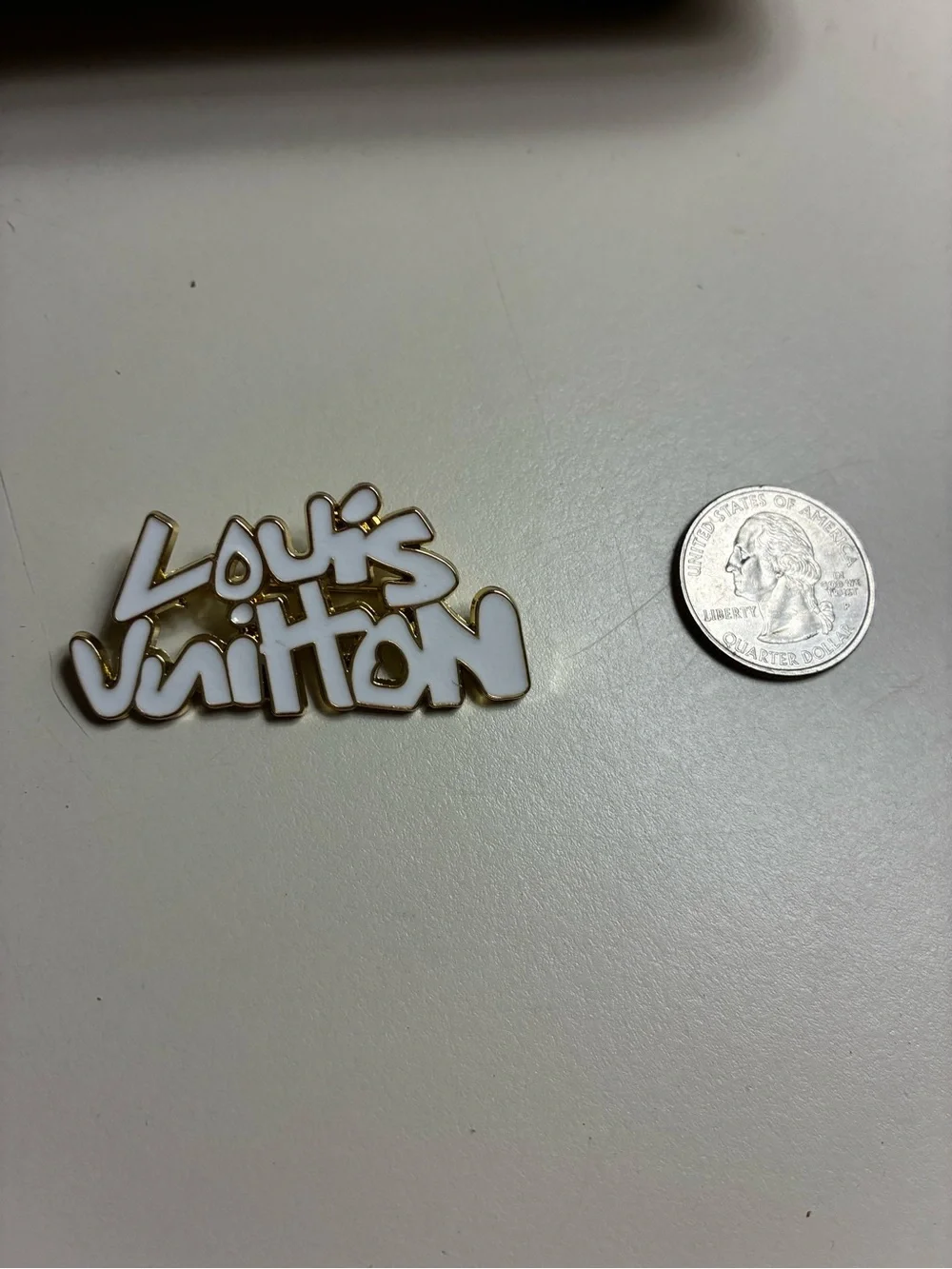 Luxury stamped LV White and Gold Logo Script Brooch